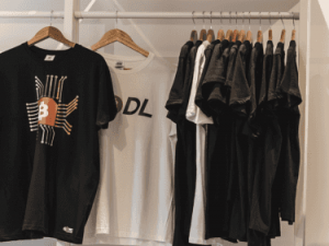 Bitcoin branded clothes on a rack
