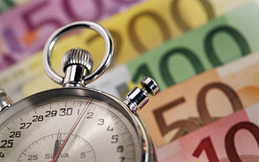 Time with a stopwatch and money with euros